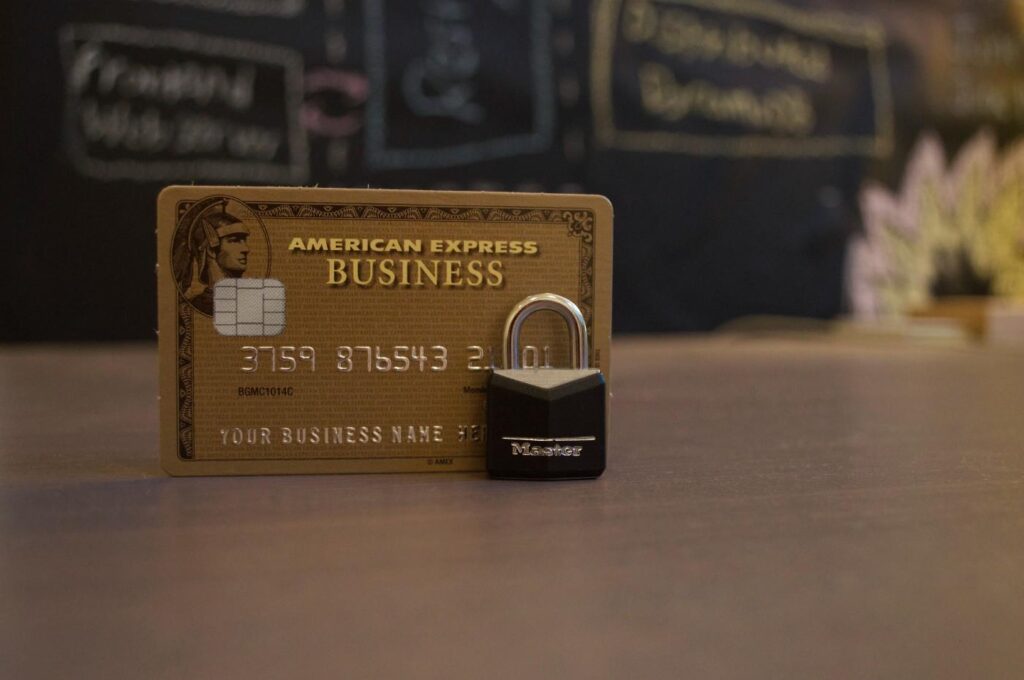 A credit card secured by a small padlock symbolizing financial security.