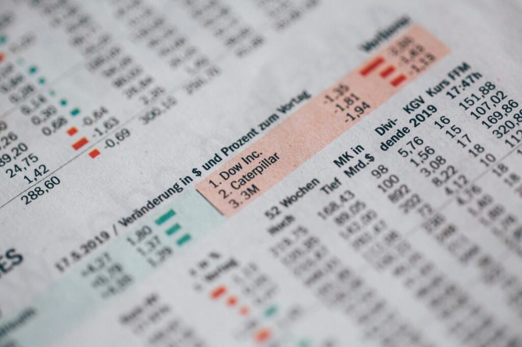 Close-up of a stock market report with highlighted financial data.