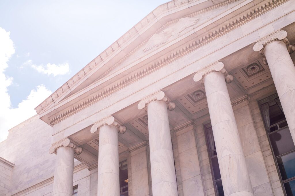 Classical building facade with tall columns and detailed architecture.