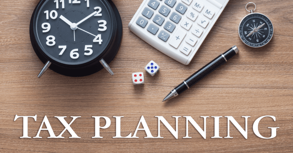 Clock, calculator, dice, and pen on a wooden desk with 'PLAN' text.