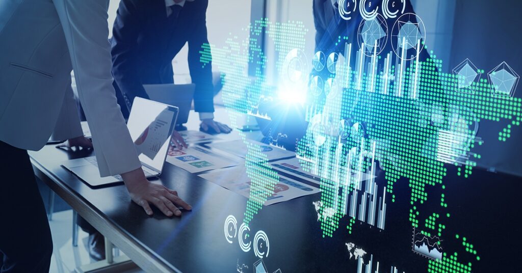 Business professionals analyzing digital data and graphs on a transparent screen.
