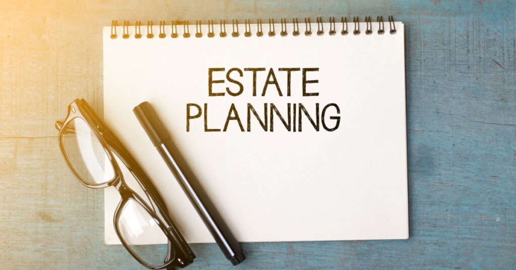 Estate planning notebook with pen and glasses