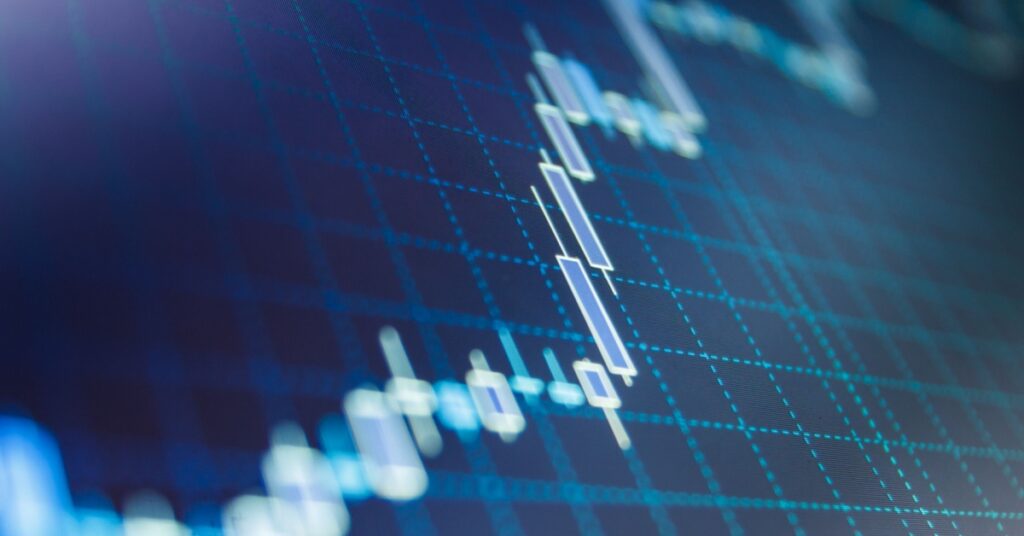 Blue candlestick stock market chart close up